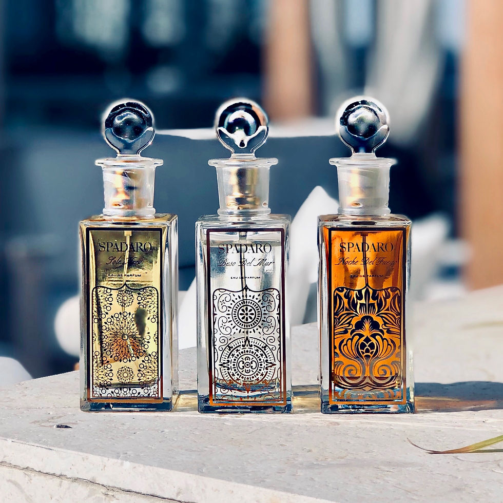 Three Spadaro Perfume Bottles next to each other