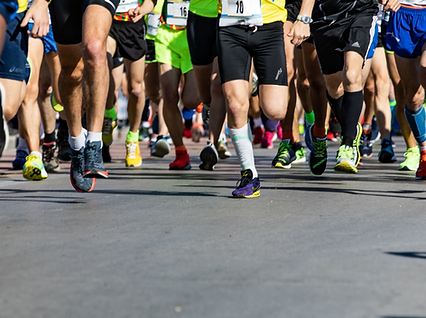 people running in a marathon in the summer