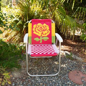 macrame folding chair with rose design