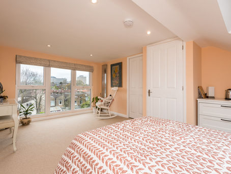 Loft bedroom overlooking the garden. Floor to ceiling Velux windows offer plenty of natural light, while the room is spacious and comfortable.