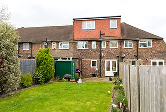Exterior of a dormer loft conversion overlooking a garden