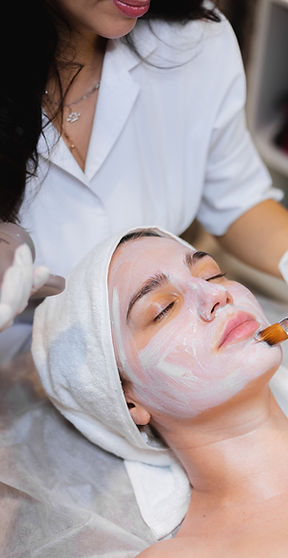beautician-with-brush-applies-white-moisturizing-mask-face-young-girl-client-spa-beauty-sa