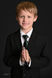 Evan’s First Holy Communion | Timeless Studio Portraits with a Dark, Classic Backdrop