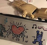 Customized case decorated by team building participants to give to recipient of prosthetic hand