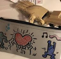 Customized case decorated by team building participants to give to recipient of prosthetic hand
