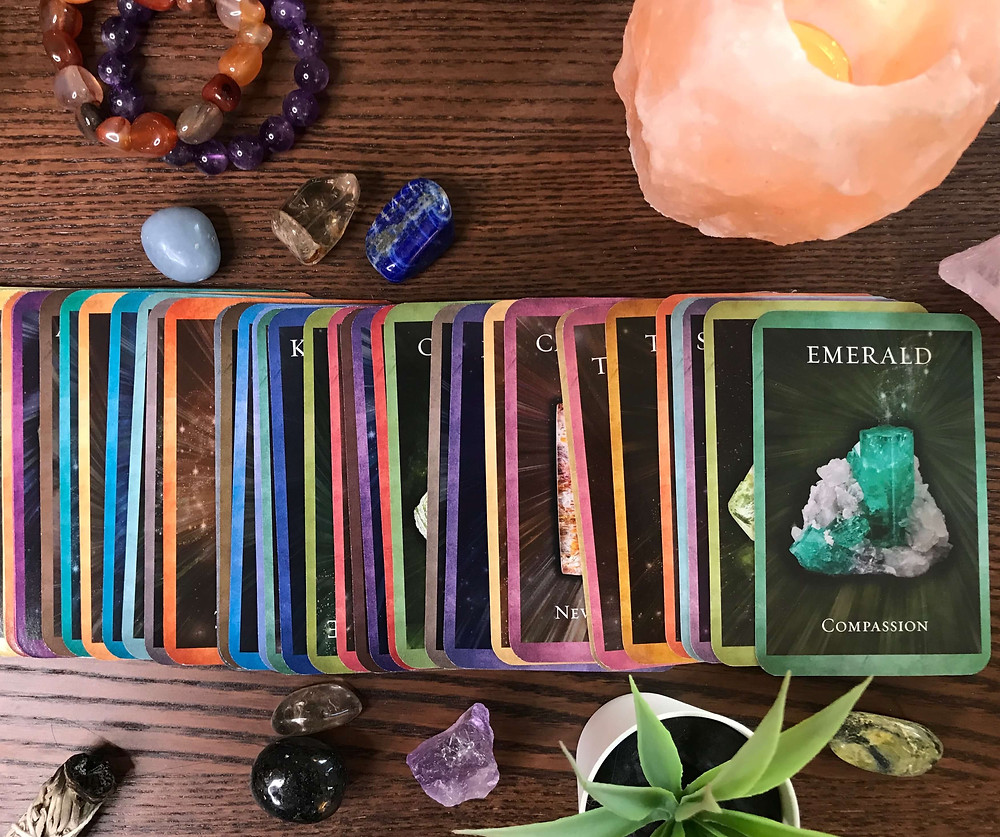 oracle cards compassion green crystal with candle