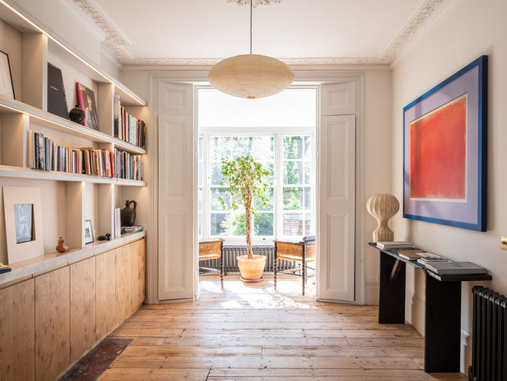 Handmade library interior featuring pippy oak cabinetry, open shelving and concealed storage