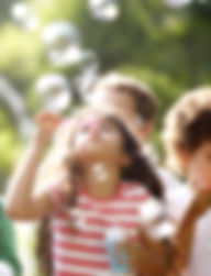 Kids Blowing Bubbles