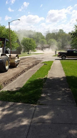 roller compacting the road