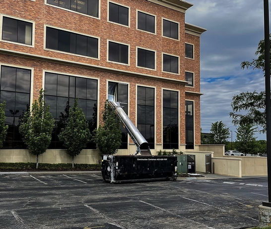 PNW Trash Chute Rentals 50ft chute in action—streamlining rooftop debris cleanup a commercial building Portland OR
