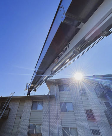 PNW Trash Chute Rentals 50ft chute in action—streamlining rooftop debris cleanup a commercial building Portland OR