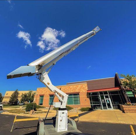 PNW Trash Chute Rentals 50ft chute in action—streamlining rooftop debris cleanup a commercial building Portland OR