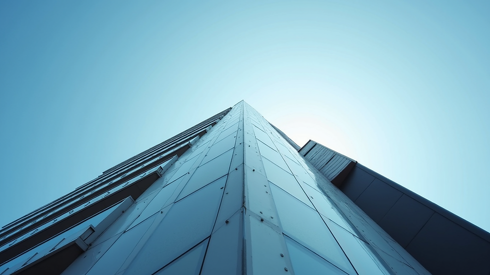 Eye-level view of a modern architectural building with a clear blue sky