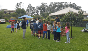 At this station Jonny Righetti is sharing facts about avocados and educating the kids about the importance of agriculture.