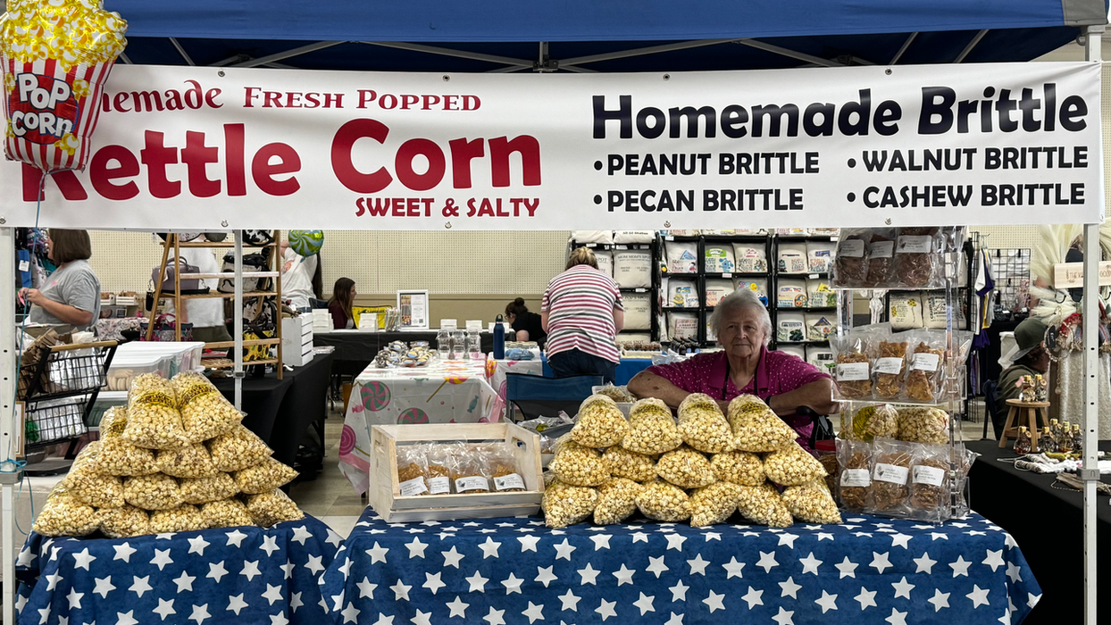 Kettle corn display indoors with a blue and white star table cloth