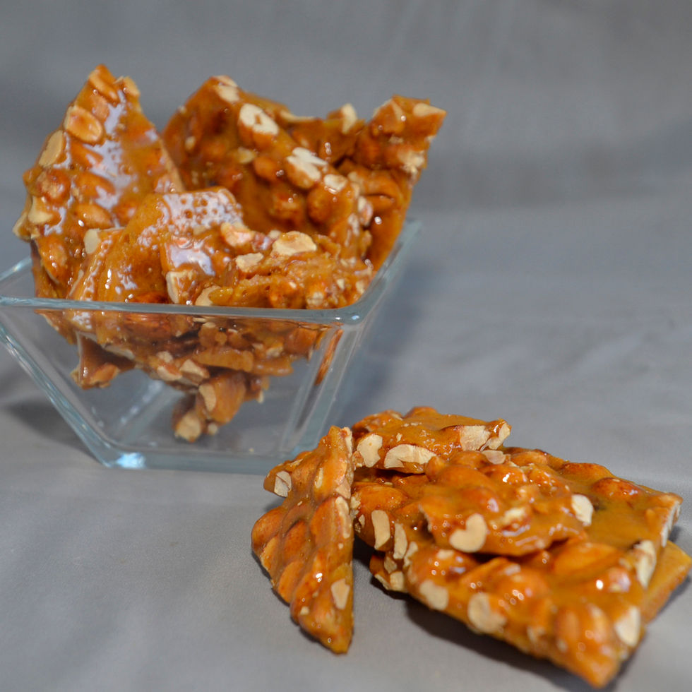 Glass candy bowl full of fresh peanut brittle