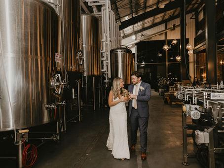 A couple walking through a brewery for a unique wedding venue in Buffalo, New York