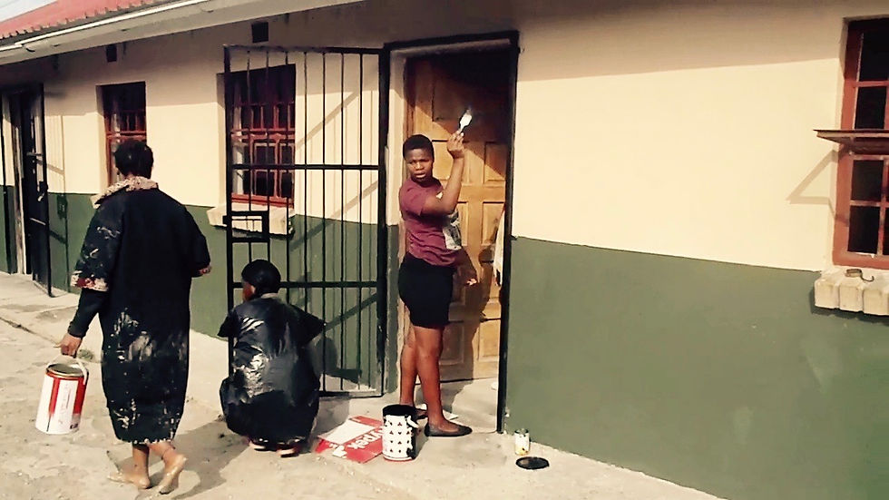 team of volunteers paint the classrooms