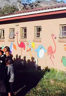 children outside the toilets newly decorated