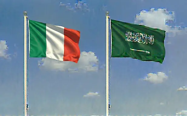 Flags of Italy and Saudi Arabia side by side against a clear sky for e-tourist visa requirements.
