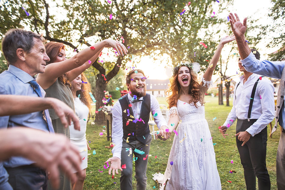 bride-groom-and-guests-throwing-confetti-at-weddi-2023-11-27-05-02-13-utc.jpg