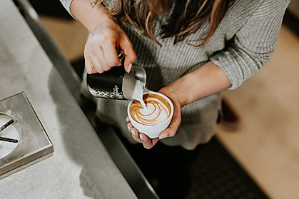 Lady pouring latte art