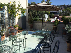 Roof terrace seating with umbrella