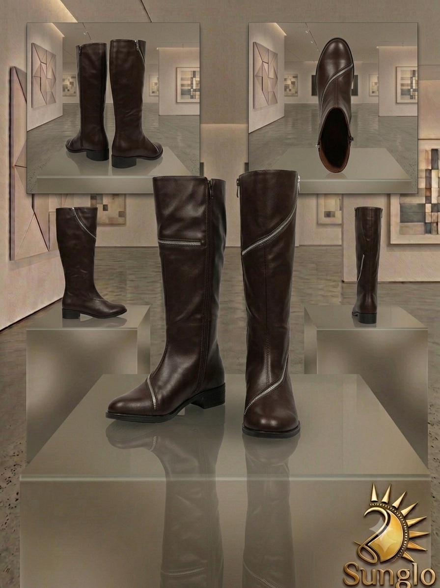 Black ladies boots displayed in a gallery setting.