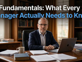 A professor at a desk with a laptop and papers, with the text "AI Fundamentals: What Every Manager Actually Needs to Know" overlaid — from The Professor