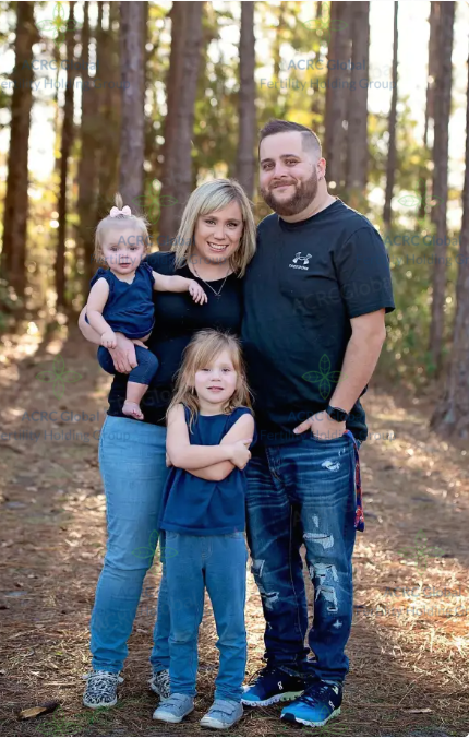 ACRC Global surrogate S with her supportive family during surrogacy journey