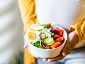 Pregnant Surrogate eating a healthy well balanced meal to show the importance of Nutrition and BMI in surrogacy