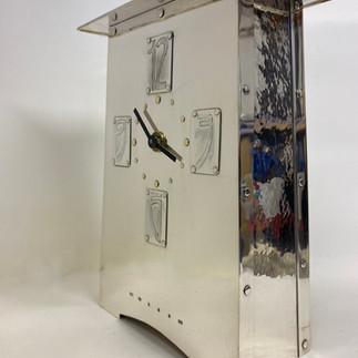 Sterling silver clock case, side view with numerals etched and riveted on to face