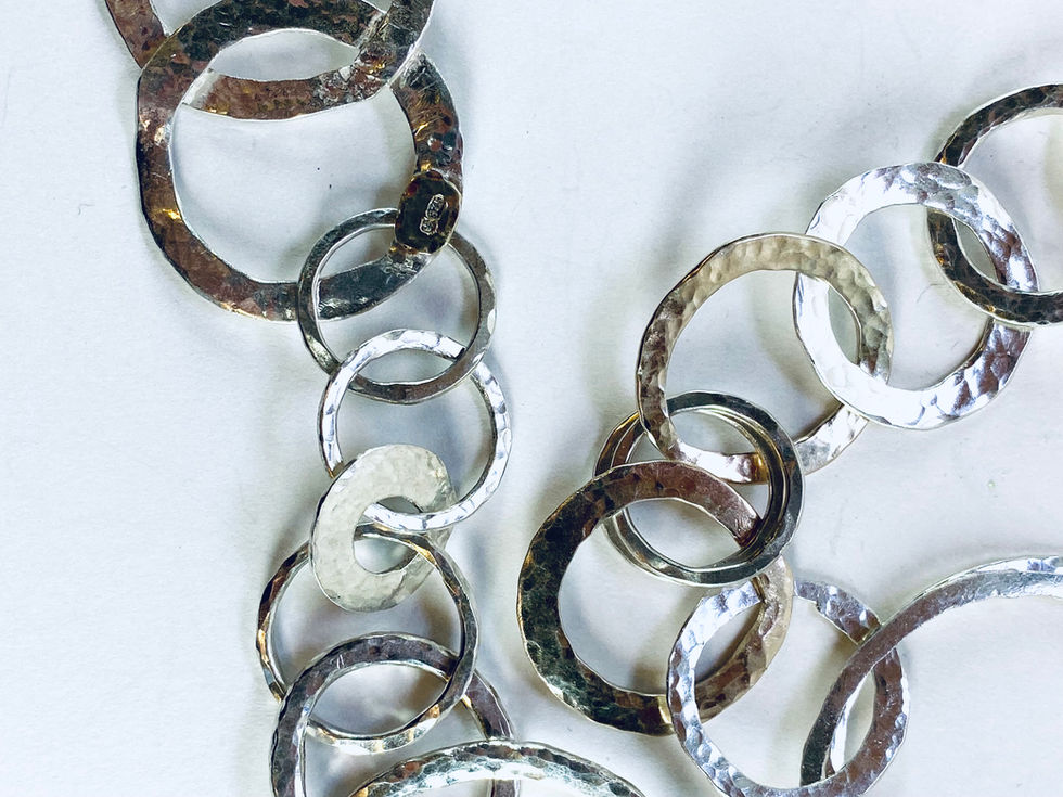 Silver and gold chain with different sized rings. Silversmith David Salariya, silver maker,
hand-crafted silver, bespoke silver items, silver artisan, silver workshop.