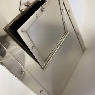 Sterling silver clock case, back, hinged opening for workings.