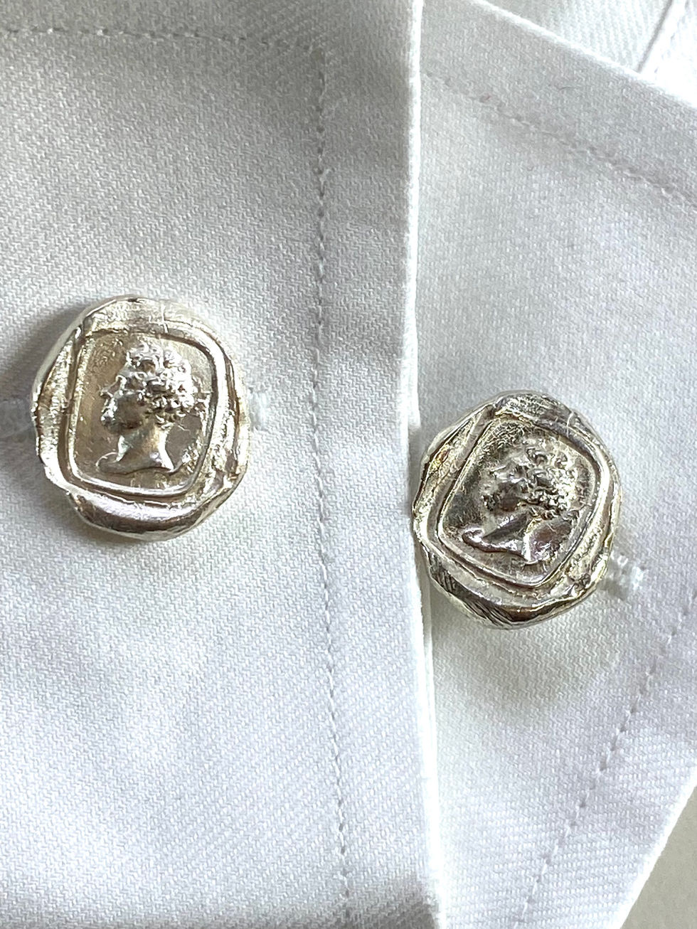 Cast carved head  sterling silver cufflinks in the style of wax seals Silversmith David Salariya, silver maker,  
hand-crafted silver, bespoke silver items, silver artisan, silver workshop.