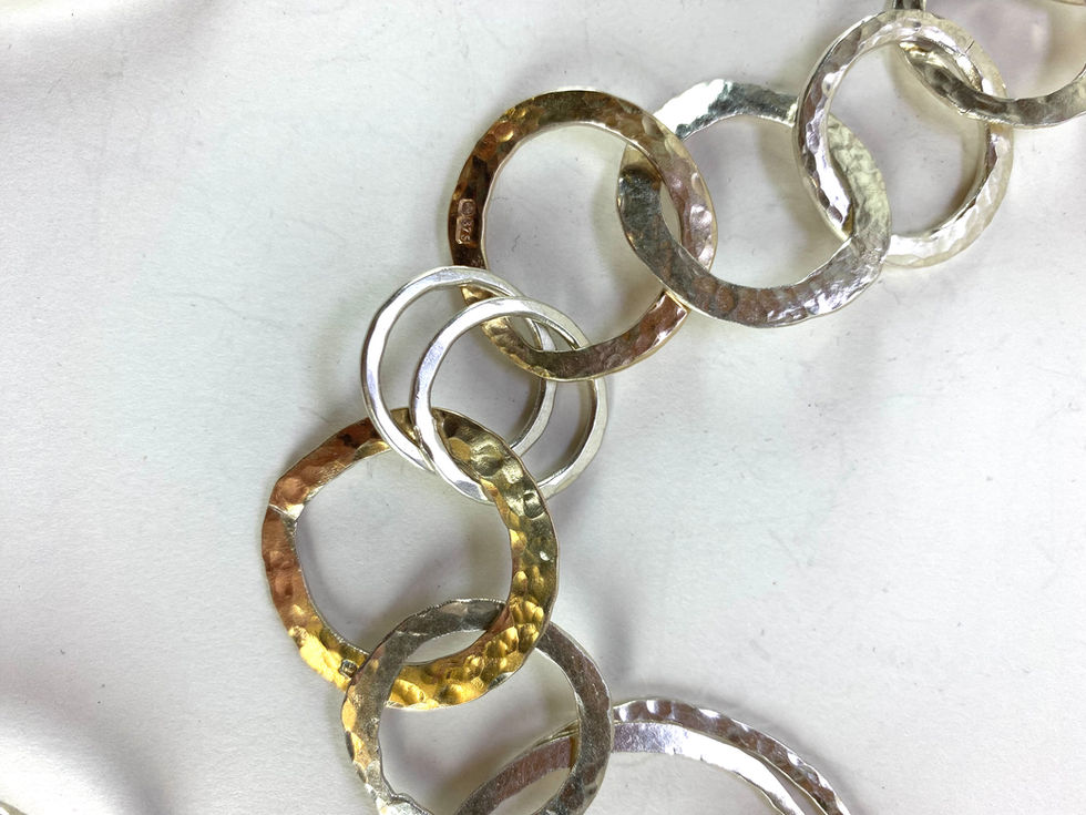 Sterling silver and gold chain made with different sized loops. Silversmith David Salariya, silver maker,
hand-crafted silver, bespoke silver items, silver artisan, silver workshop.