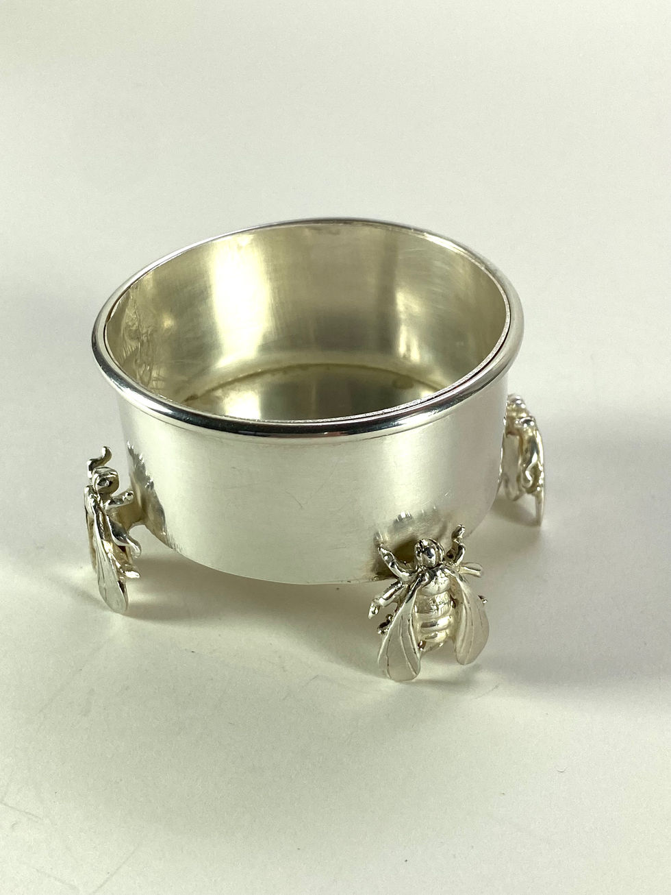 Sterling silver container supported by bees.. Silversmith David Salariya, silver maker,  
hand-crafted silver, bespoke silver items, silver artisan, silver workshop.