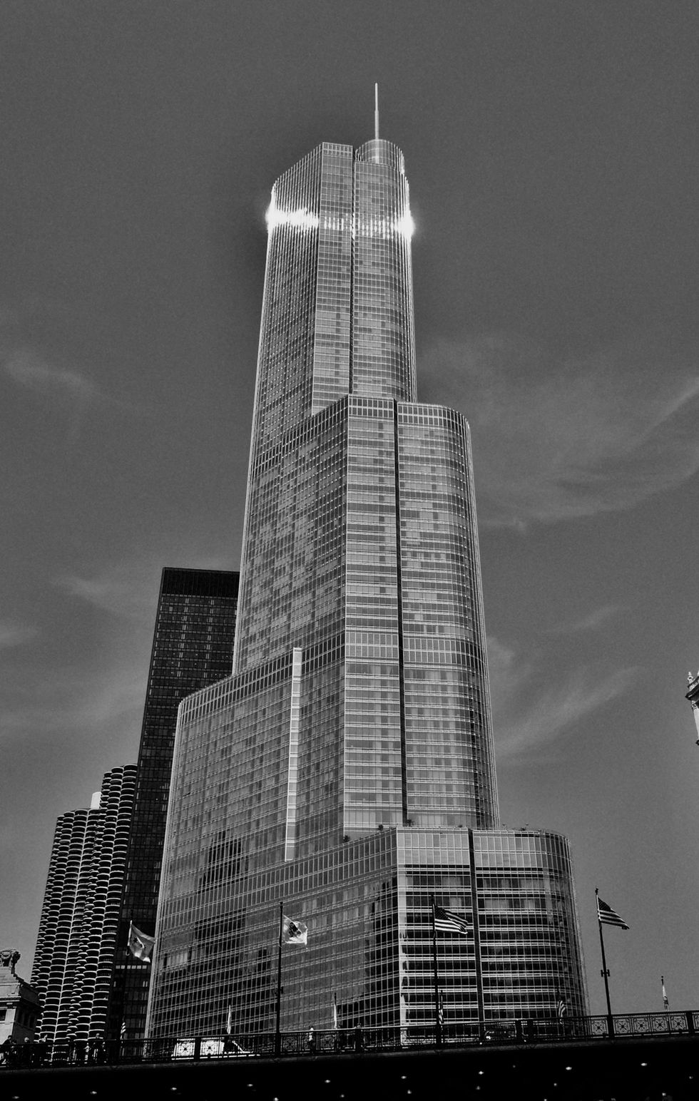 a black and white photo of a very tall building