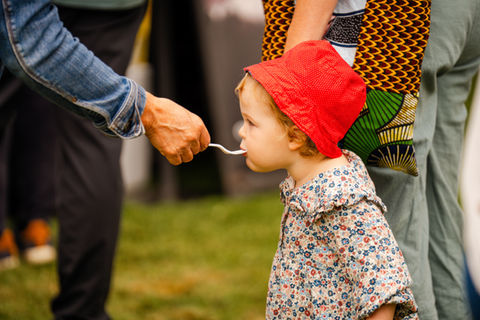 Young boy enjoying sample at Garlic Festival in Clatskanie.