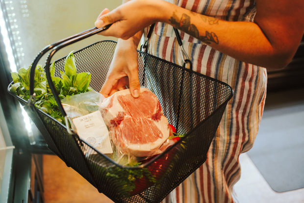 Handbasket full of fresh produce at meats from Clatskanie Food Hub.