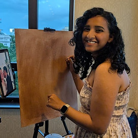 Toronto live wedding painter Renu painting a portrait at her easel