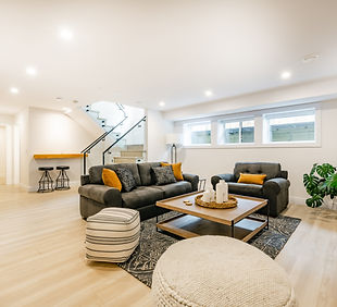 recreation party room with bar stairs with glass rails downstairs basement interior room w