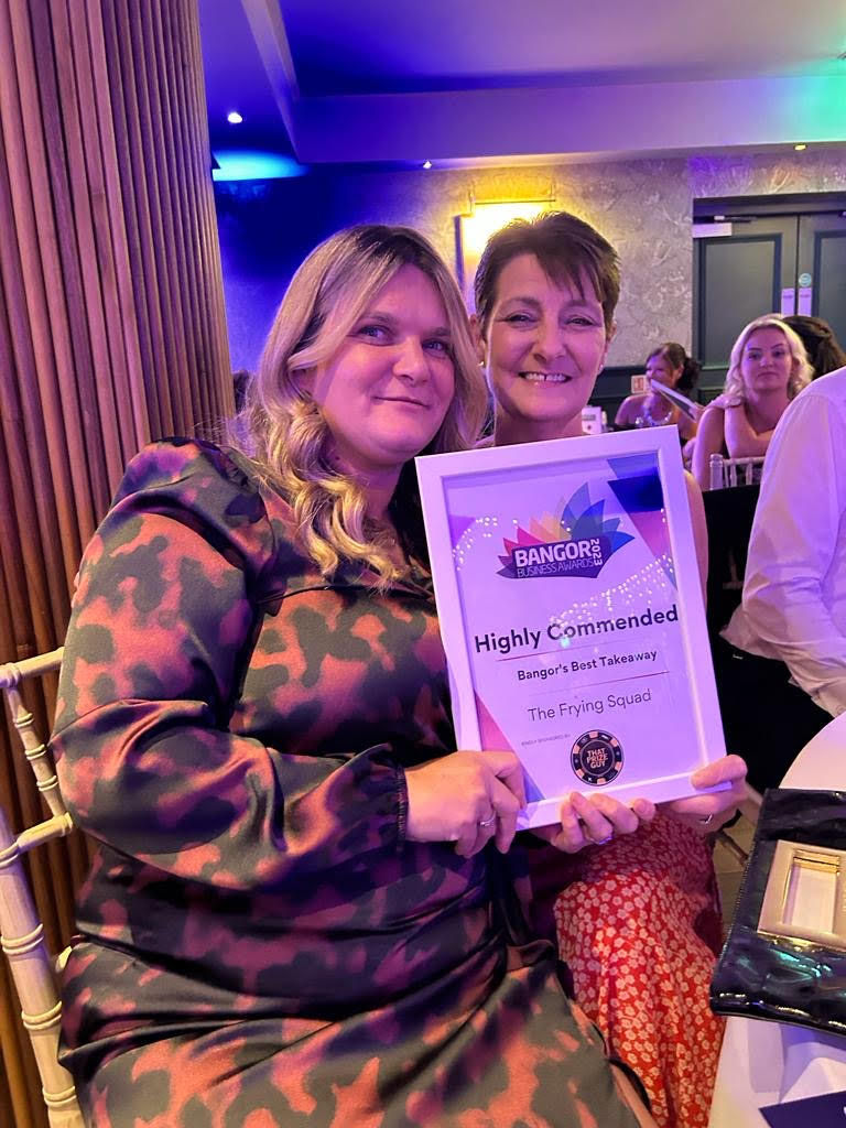 Julie and Maureen holding their award as highly recommended for the Bangor's Best Takeaway category
