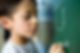 Boy Writing on a Blackboard