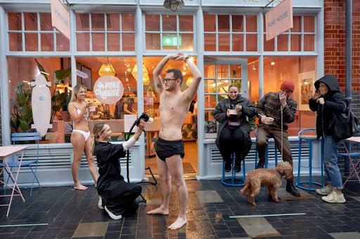 customers enjoy the food and get a spray tan at the new Poke House London Spitalfields restaurant