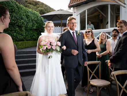 Professional Wedding Videography and Photography at Pilu at Freshwater of a bride walking down the aisle with her father