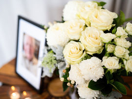 Funeral Photography and Videography of floral bouquet at commemorative lunch for the deceased