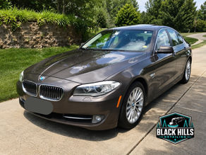 a brown bmw with a ceramic coating after mobile detailing