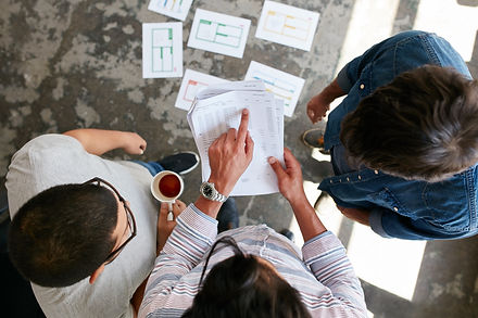 People looking at financial documents