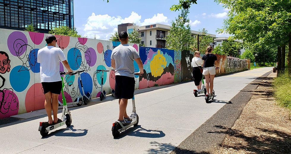 Men and women riding scooters on the Atlanta BeltLine
